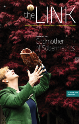 The cover of The Link features a woman catching a baseball.