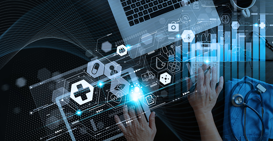 A decorative image featuring a laptop and human hands overlaid with computer imagery.
